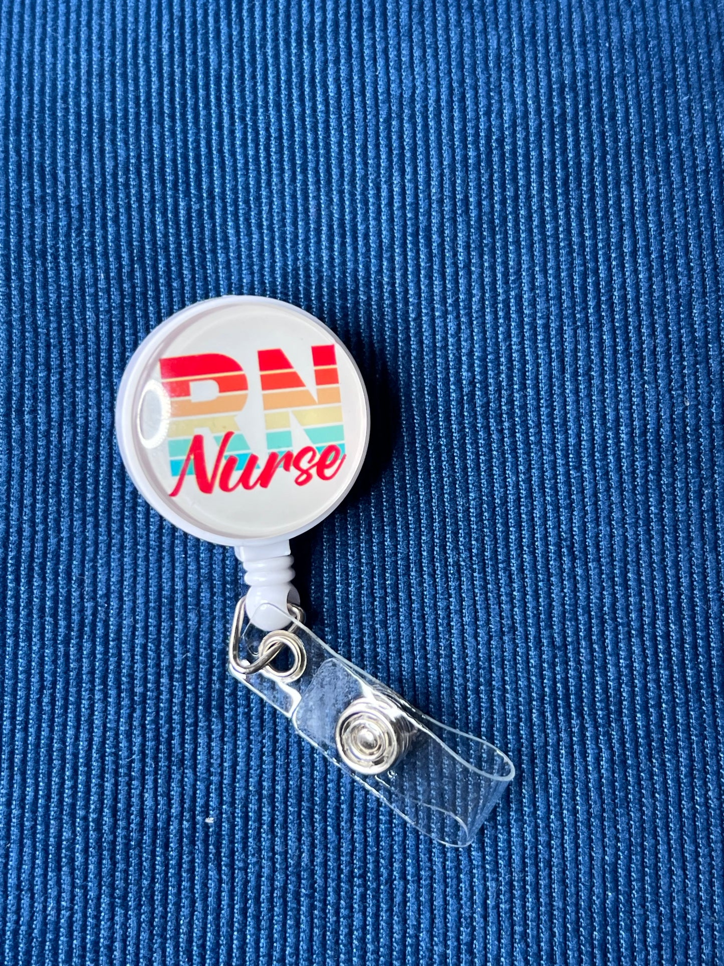 Retractable badge reel