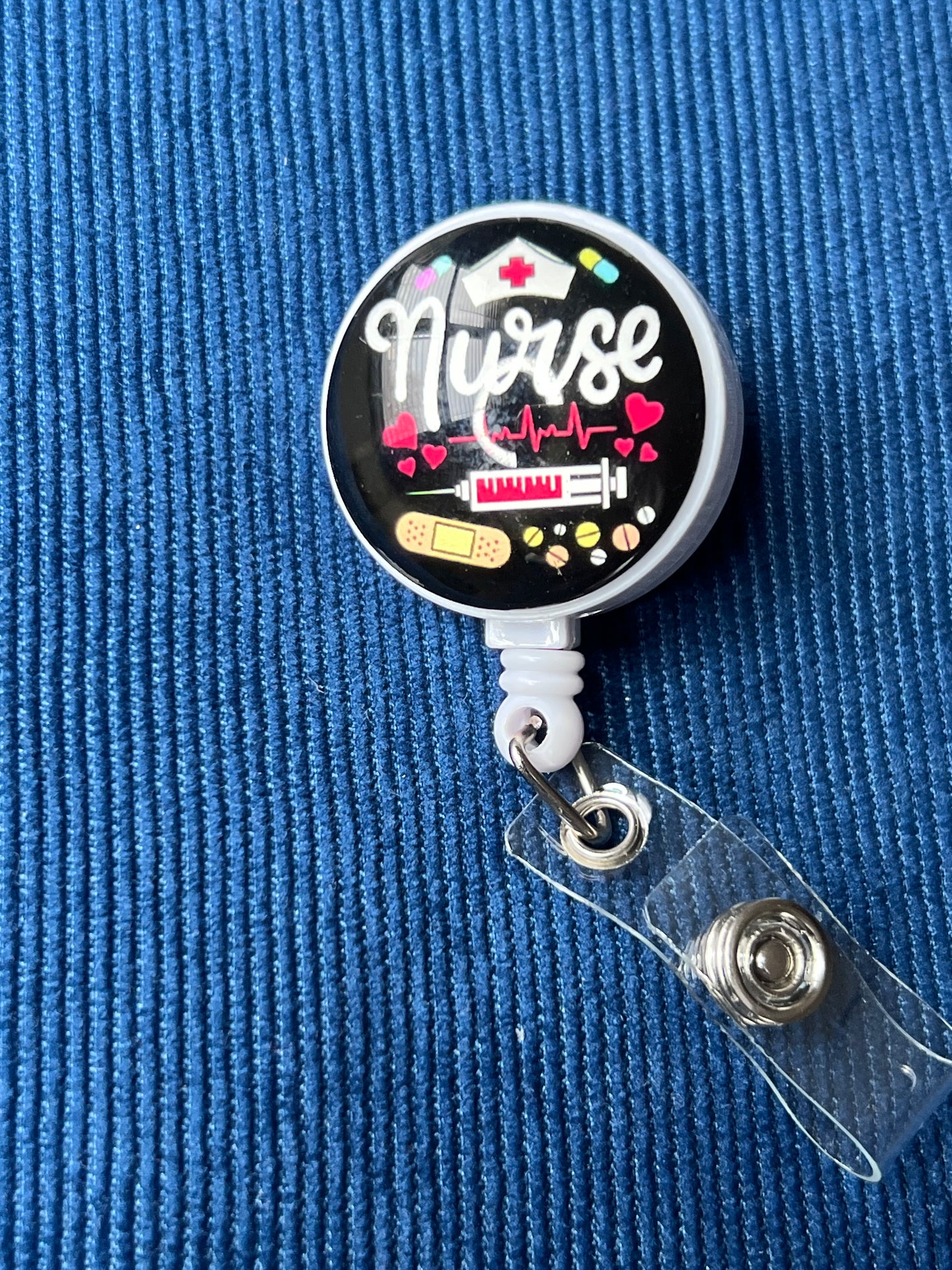 Retractable badge reel